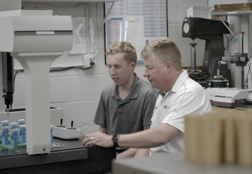 Two Spacelution Team Members working together at a desk